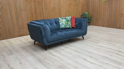 Video of The 'Rene' 2 Seater Sofa in a room setting, emphasizing its contemporary/modern style and elegant blue color.