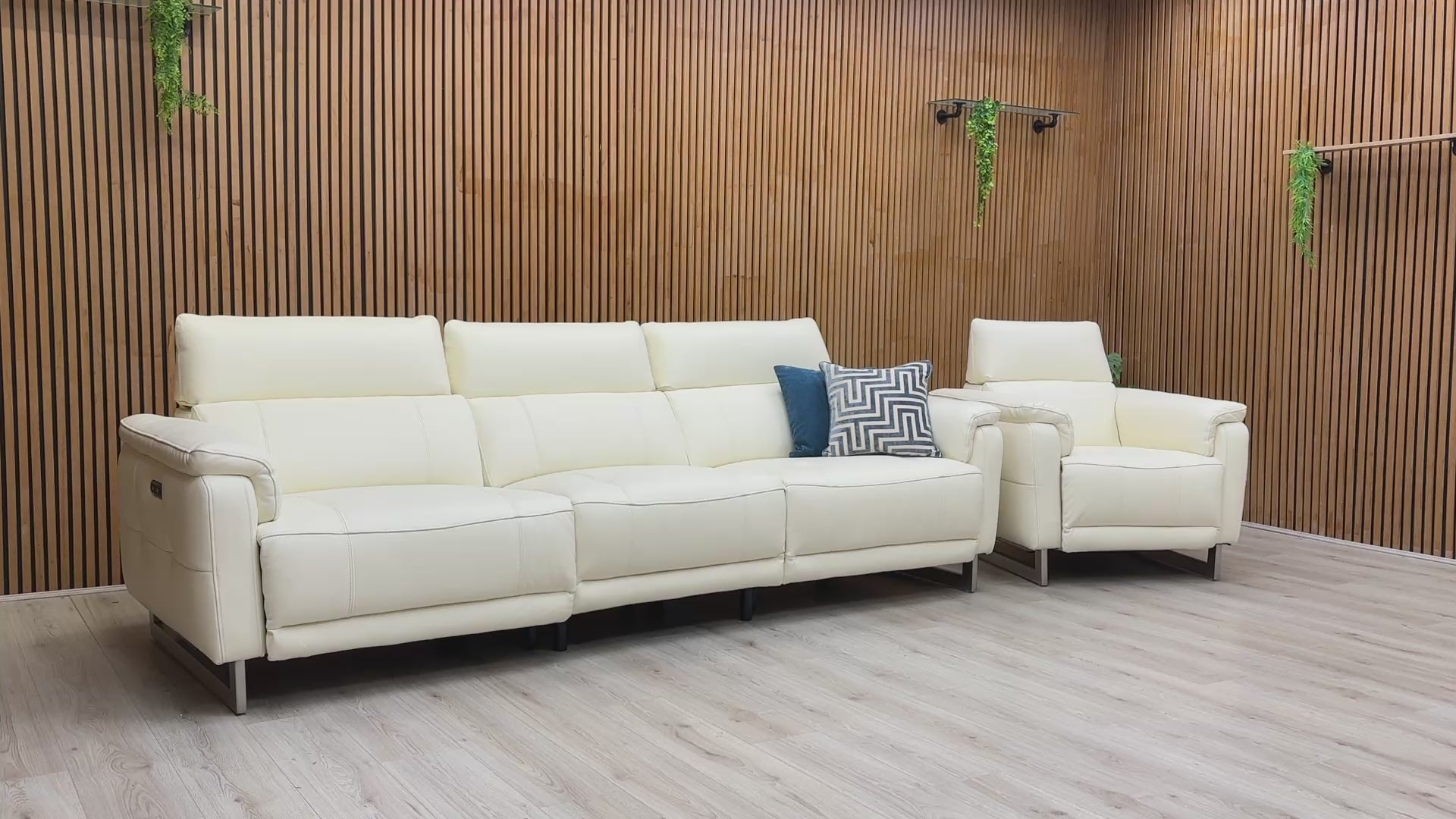 Product video tour of the ‘Moet’ Cotton White Leather Recliner Set, demonstrating the smooth power reclining mechanism, telescopic headrest adjustment, and leather quality.