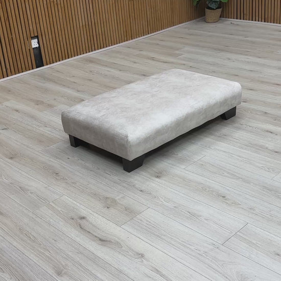 Video of showing the large surface area of the Kenzo Cream Designer Footstool.