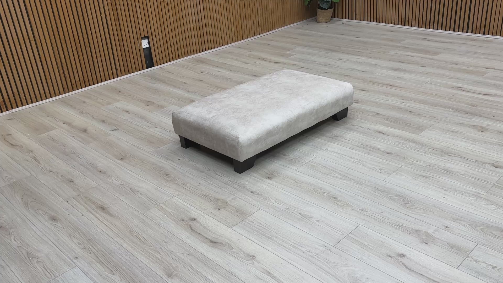 Video of showing the large surface area of the Kenzo Cream Designer Footstool.