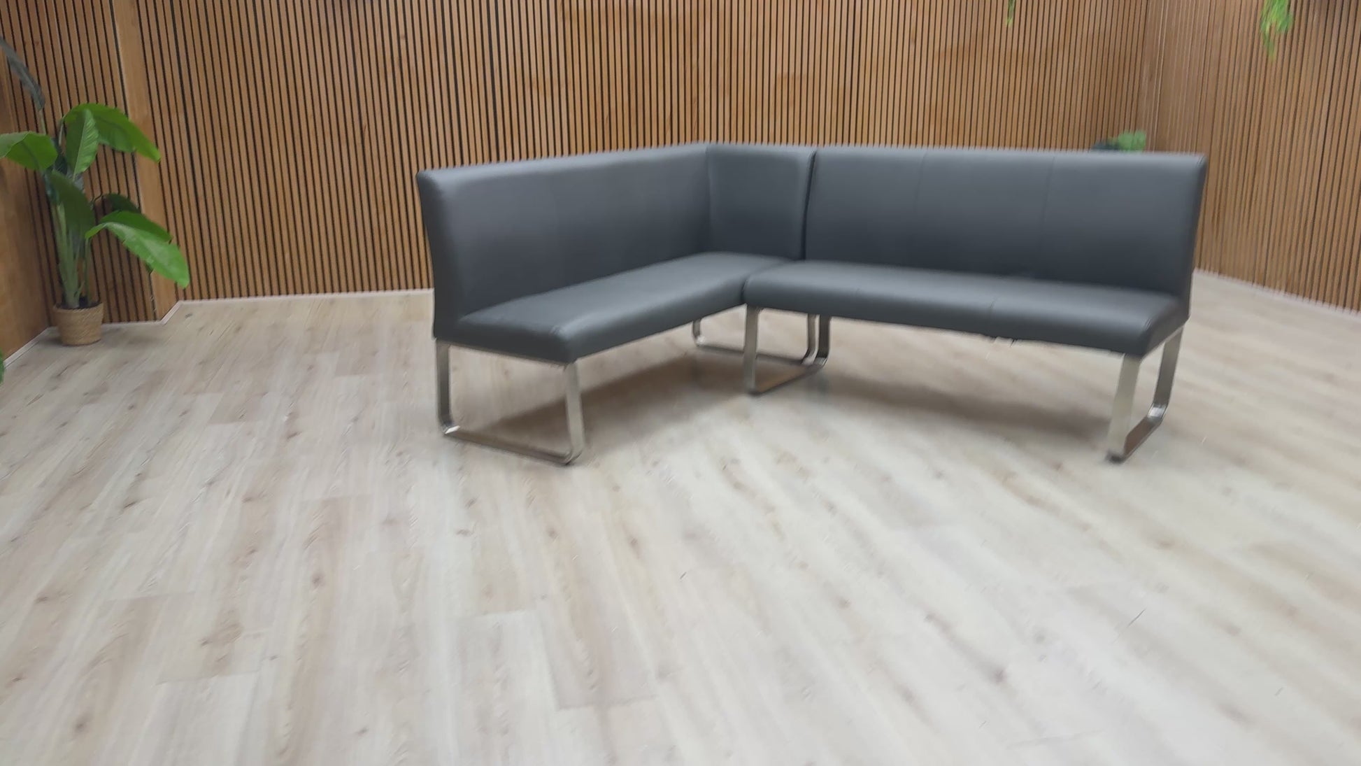 Video demonstration of the Cocoon corner bench's sturdy build and the smooth texture of its grey faux leather.
