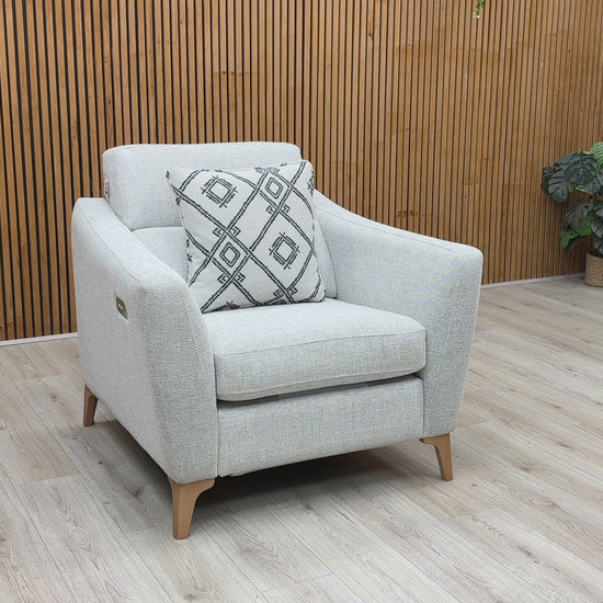 Video walkthrough showcasing the Moderna pearl grey fabric power recliner chair, demonstrating the smooth electric motor operation, fabric resilience under showroom lighting, and smooth return motion.