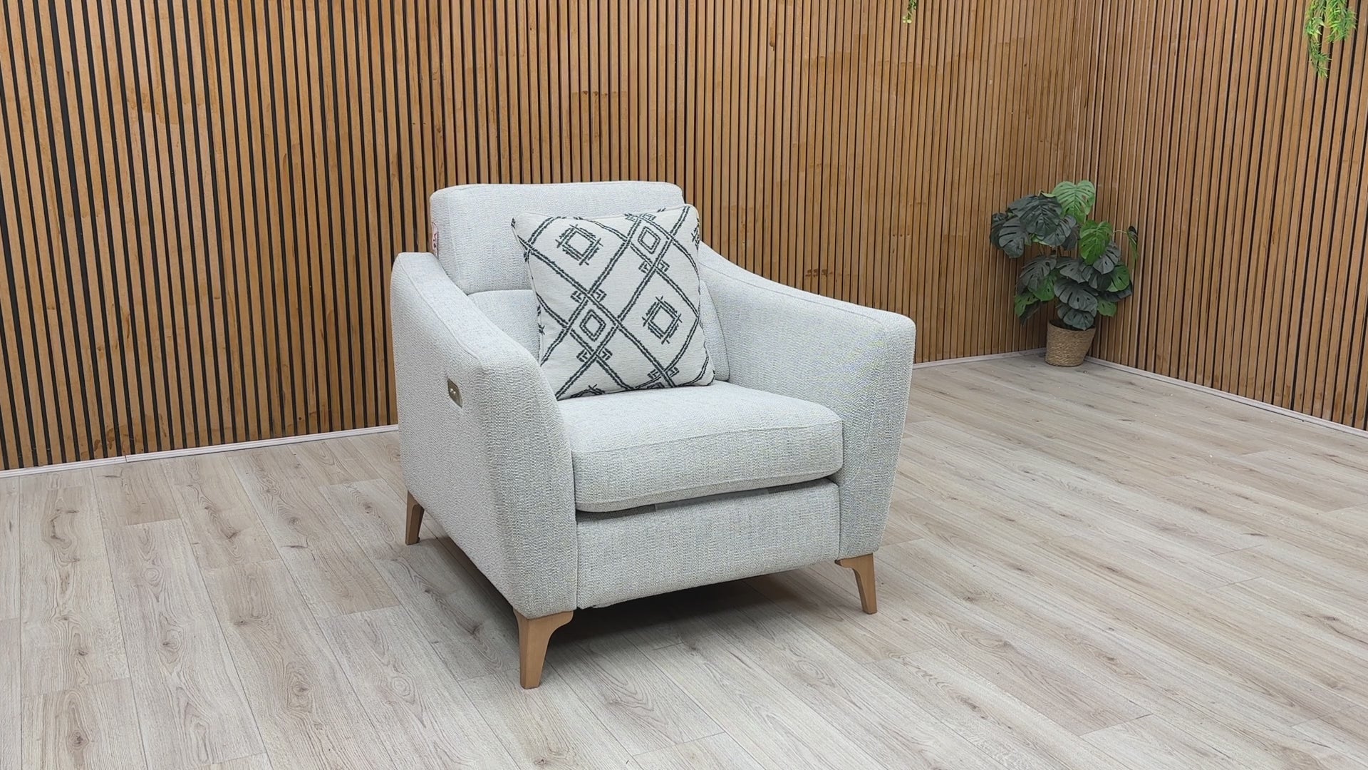 Video walkthrough showcasing the Moderna pearl grey fabric power recliner chair, demonstrating the smooth electric motor operation, fabric resilience under showroom lighting, and smooth return motion.