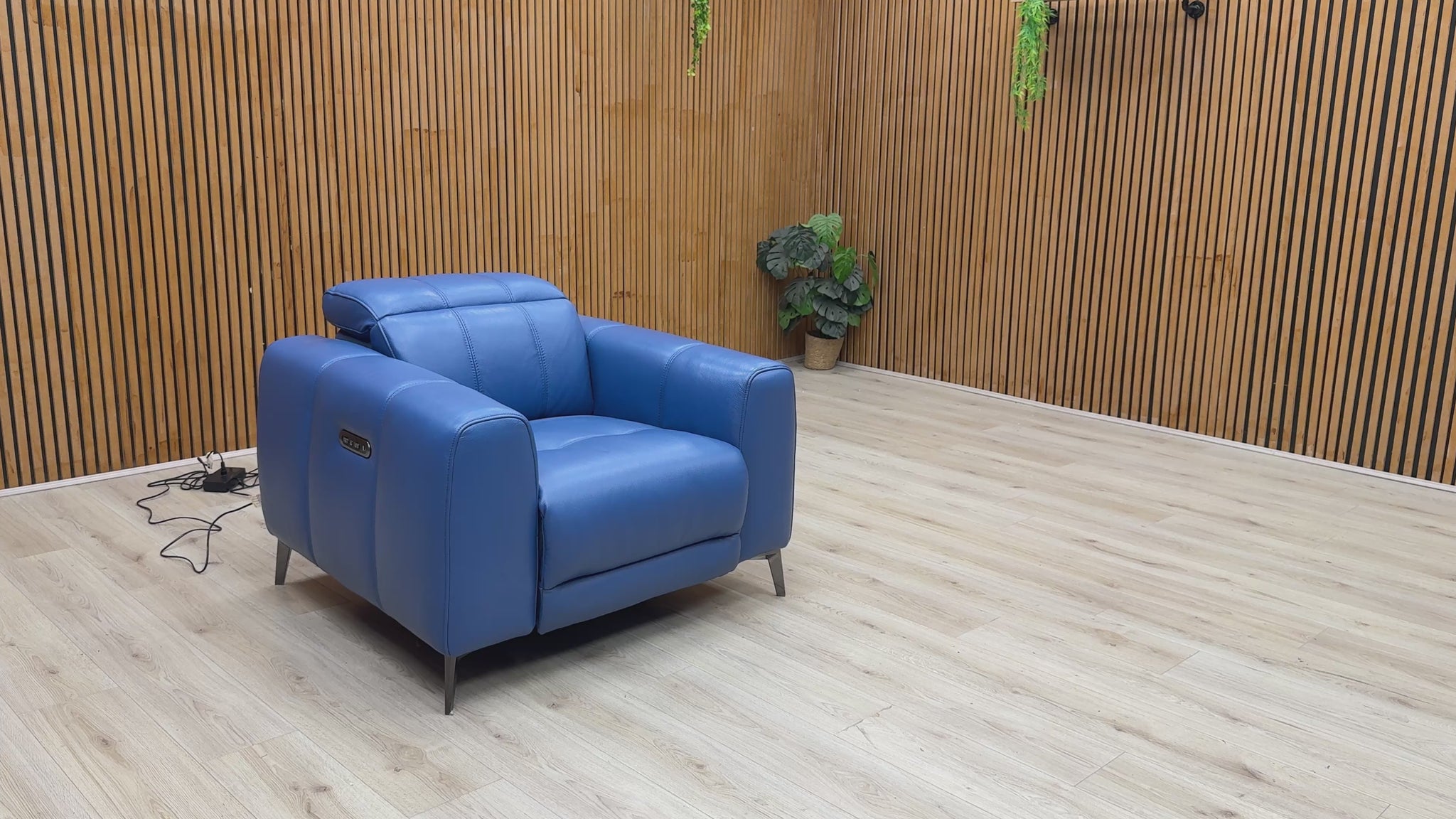 Video Furniture Village ‘Ezra’ premium power recliner armchair, expertly tailored in luxurious Category 40 Aegean blue leather upholstery.