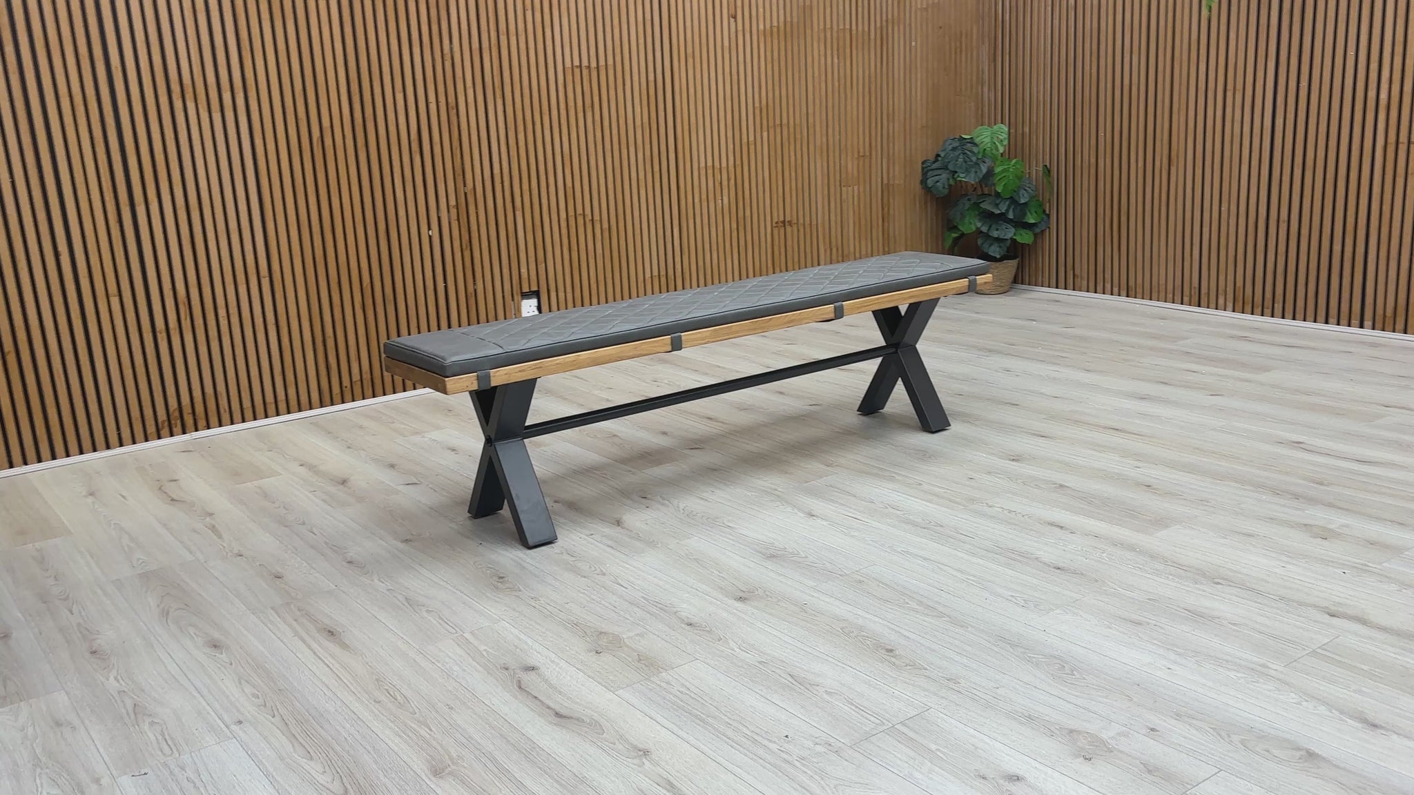 A video of Bench with black seat and wooden sides on a white background
