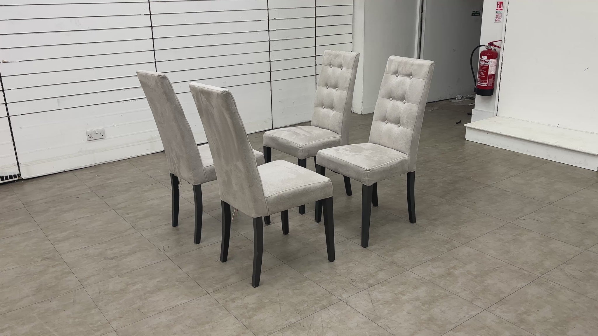 Video for a clip demonstrating the features, fabric texture, and shape of the 'Mia' Silver Suede High Back Button Back Dining Chair.