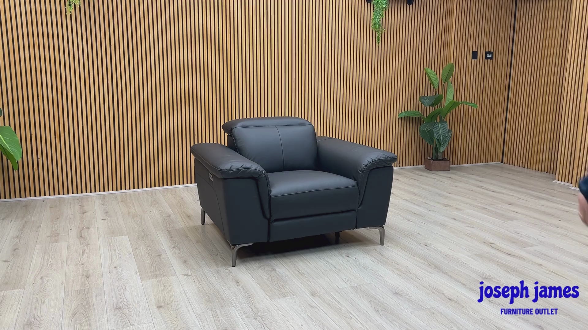 Video Of ‘Lorenza’ contemporary power recliner armchair, beautifully upholstered in a premium matte Black Leather Mix finish.