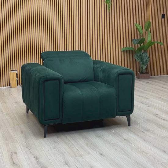 Video Of ‘Elphaba’ contemporary power recliner armchair, beautifully upholstered in an elegant, rich Opulence Bottle Green fabric, featuring integrated storage armrests.