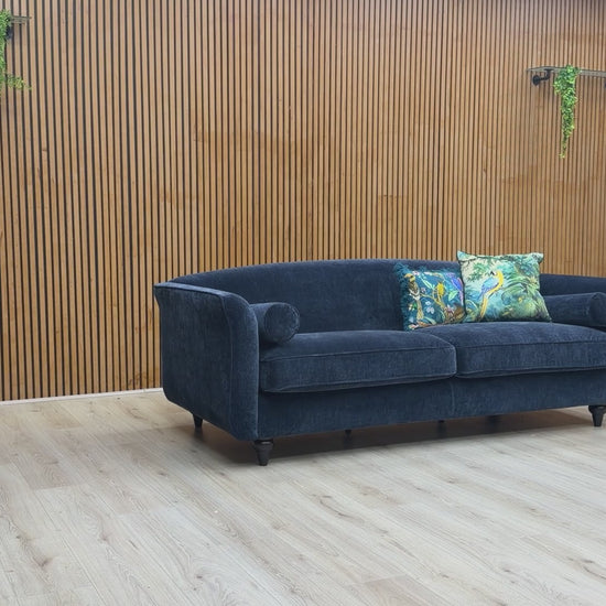 Video showcase of the Dame navy blue 4-seater sofa, demonstrating fabric quality and seat firmness.