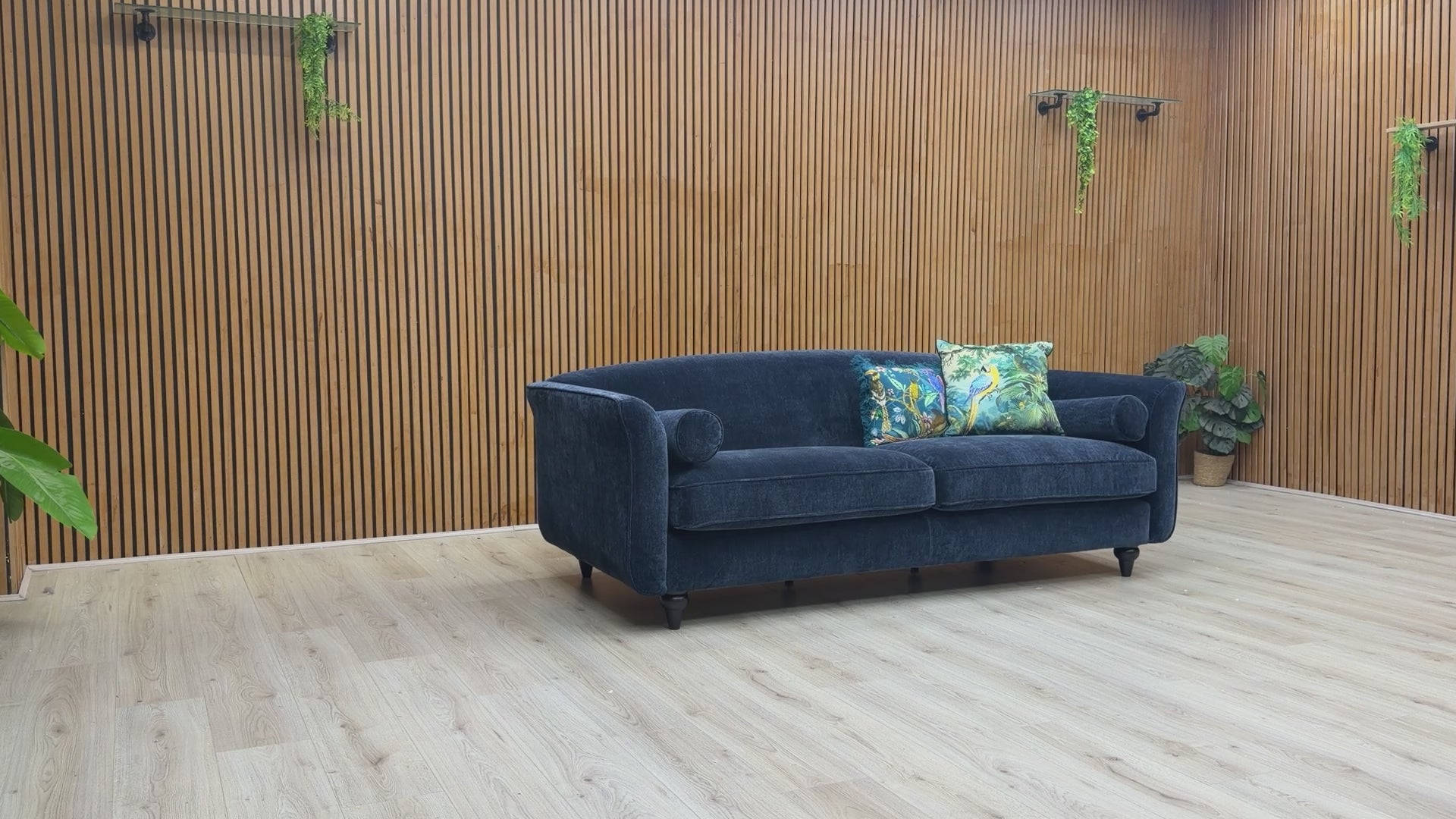 Video showcase of the Dame navy blue 4-seater sofa, demonstrating fabric quality and seat firmness.