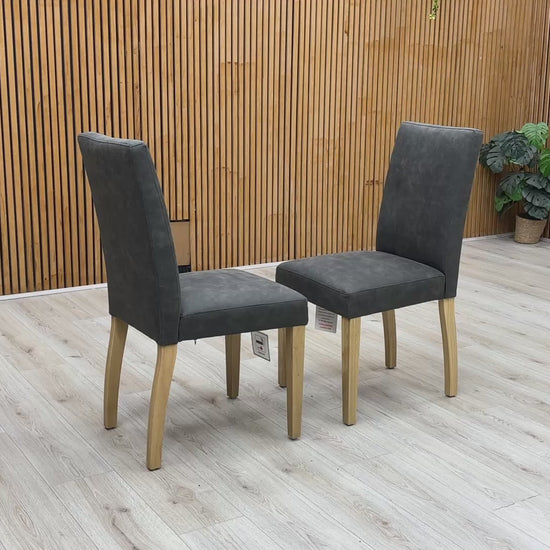 Product video tour of the Furnitureland ‘Augusta’ Grey Cowboy Upholstered Dining Chairs, demonstrating the fabric’s unique texture, the resilience of the seat padding, and overall structural stability.