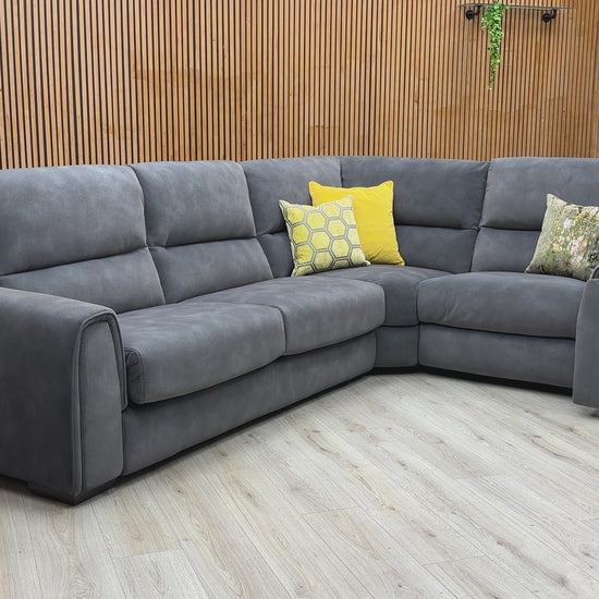 Video walkthrough showcasing the Flex graphite grey fabric corner sofa bed, demonstrating the smooth power recliner operation, pull-out bed conversion, and storage arm utility.