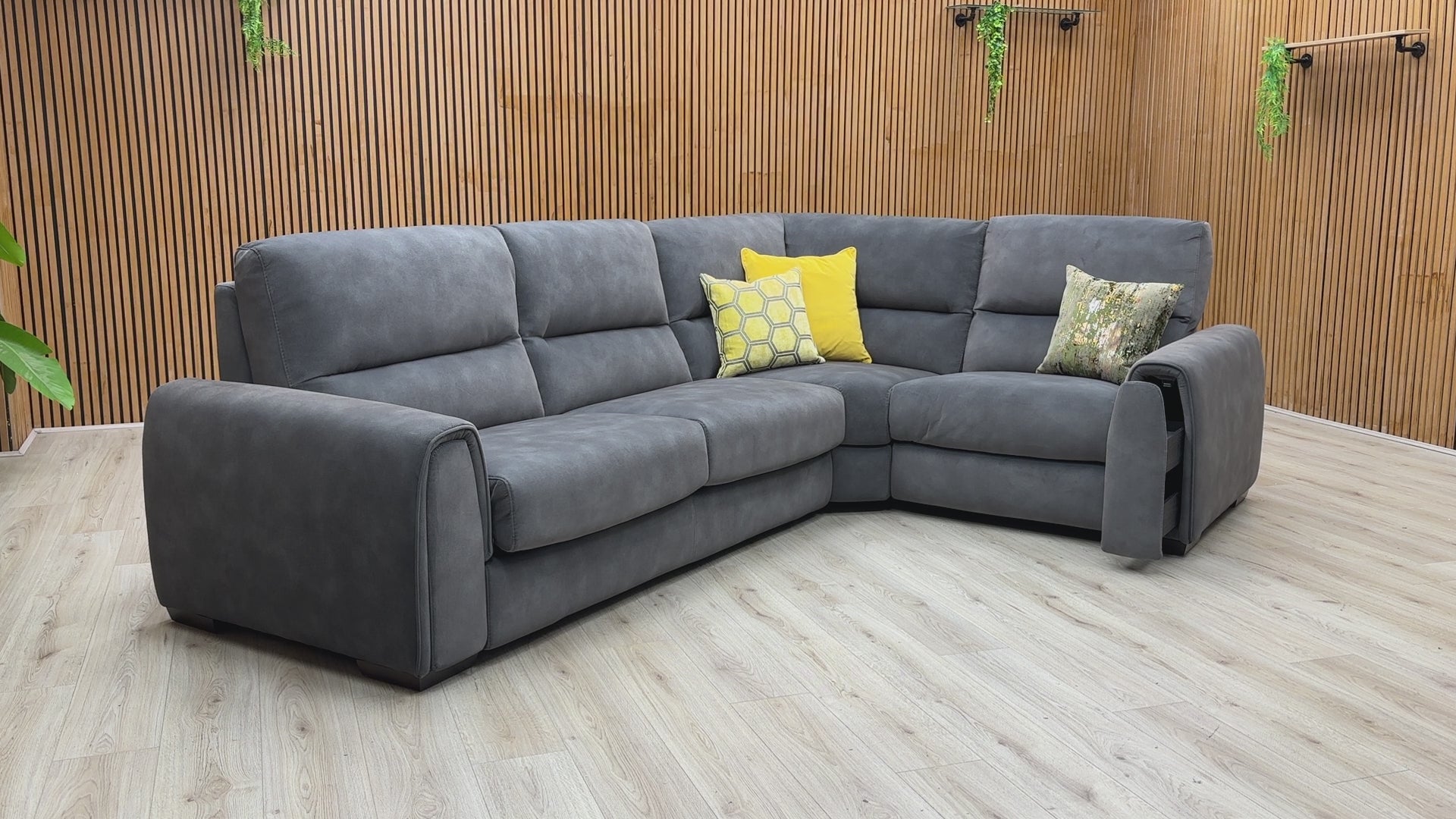 Video walkthrough showcasing the Flex graphite grey fabric corner sofa bed, demonstrating the smooth power recliner operation, pull-out bed conversion, and storage arm utility.