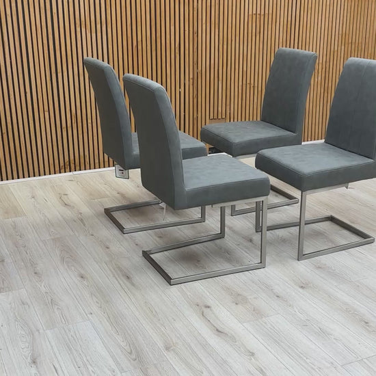 Video demonstration of the ‘Grigio’ dining chairs, illustrating the subtle flex of the cantilever base and the quality of the grey faux leather.