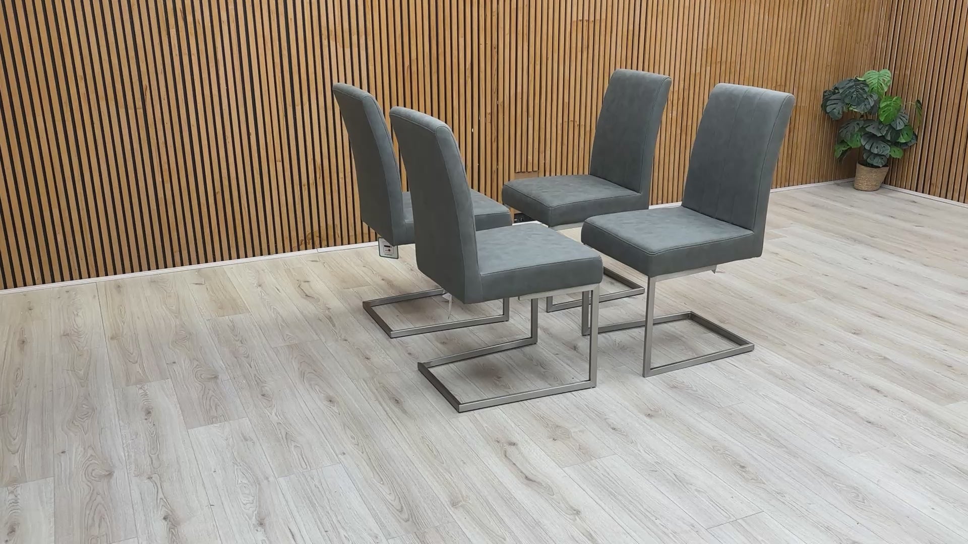 Video demonstration of the ‘Grigio’ dining chairs, illustrating the subtle flex of the cantilever base and the quality of the grey faux leather.