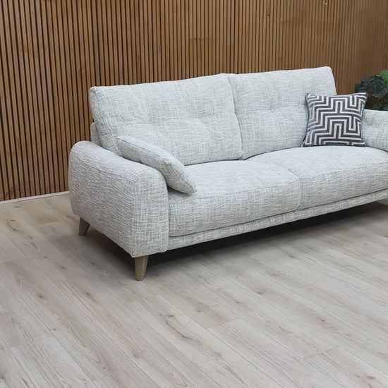 Video tour of the ‘Malmo’ 3-seater sofa, demonstrating the soft fabric texture and the all-over support of the sprung seat suspension.