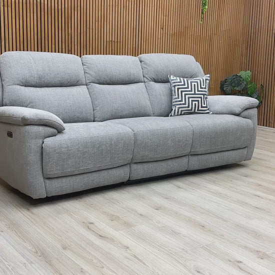 Product video tour of the ‘Touch’ Pewter Fabric 3 Seater Power Recliner, demonstrating the smooth reclining motion, the fabric's durability, and the USB port functionality.