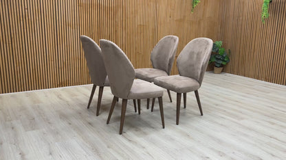 Video of a single Stone International ‘Empire’ R066 Dining Chair, highlighting the comfortable foam cushioning and high-end modern look.
