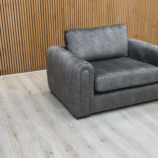 Video tour of the ‘Amara’ charcoal velvet snuggle chair, demonstrating the fabric’s sheen and seat comfort.
