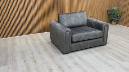 Video tour of the ‘Amara’ charcoal velvet snuggle chair, demonstrating the fabric’s sheen and seat comfort.