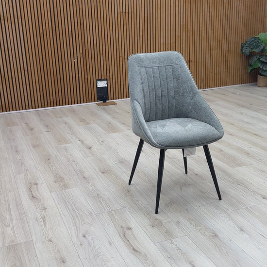 Video Of ‘Crete’ contemporary swivel dining chair, beautifully upholstered in a sophisticated, textured Light Grey fabric with clean, modern lines.
