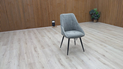Video Of ‘Crete’ contemporary swivel dining chair, beautifully upholstered in a sophisticated, textured Light Grey fabric with clean, modern lines.