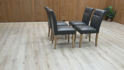 Video demonstration of the Lewis set of 4 dining chairs, showing the cushioned seating and rubberwood legs.