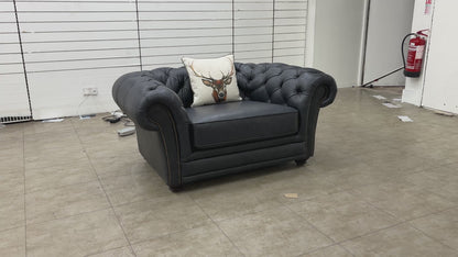 Video showcasing the 'Savannah' navy blue leather snuggler chair from multiple angles, highlighting the quality of the leather and construction.