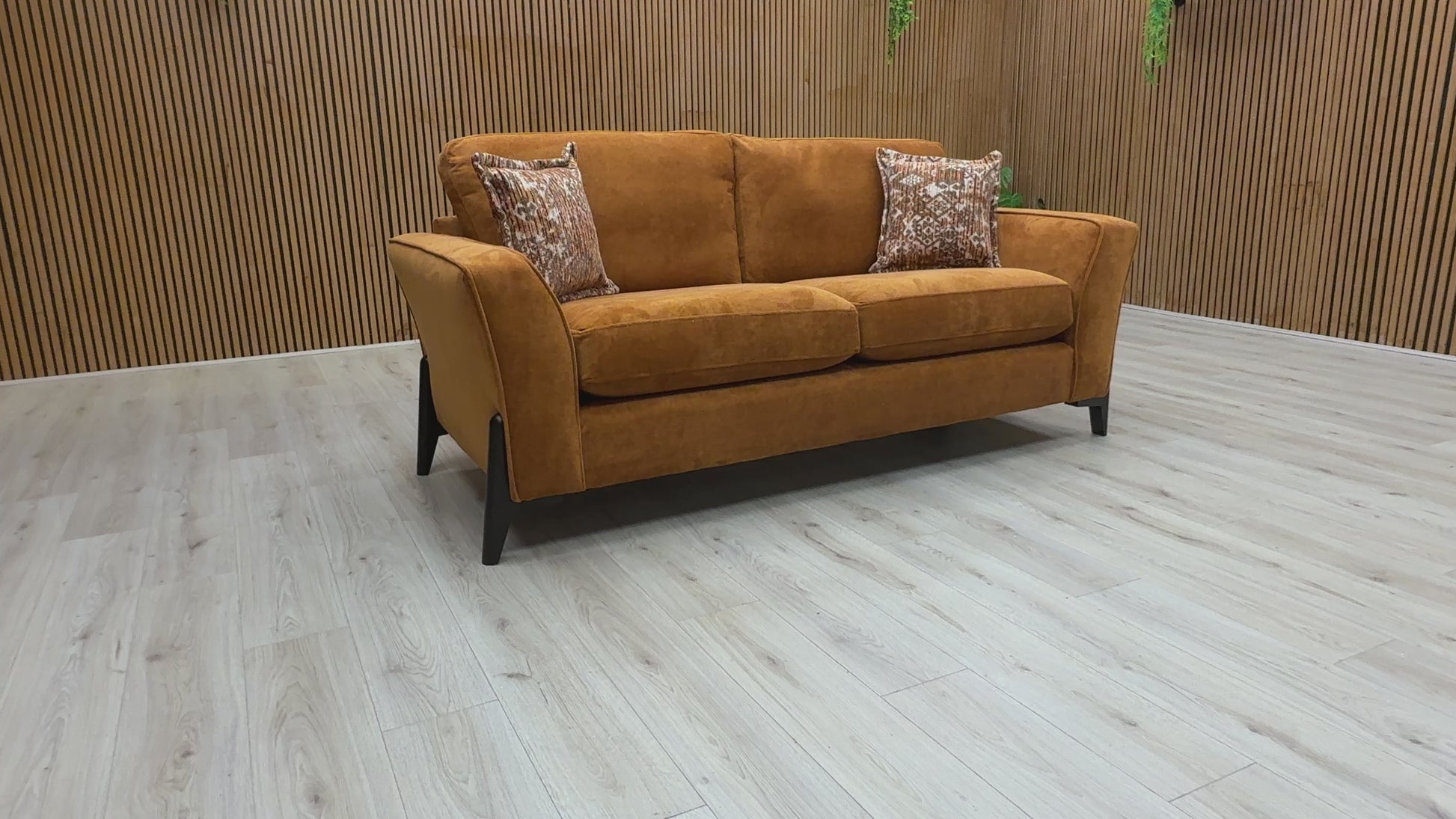 Video preview image for the product, demonstrating the size, fabric, and overall features of the 'Collins' Almond Orange Towel Velvet 3 Seater Sofa.