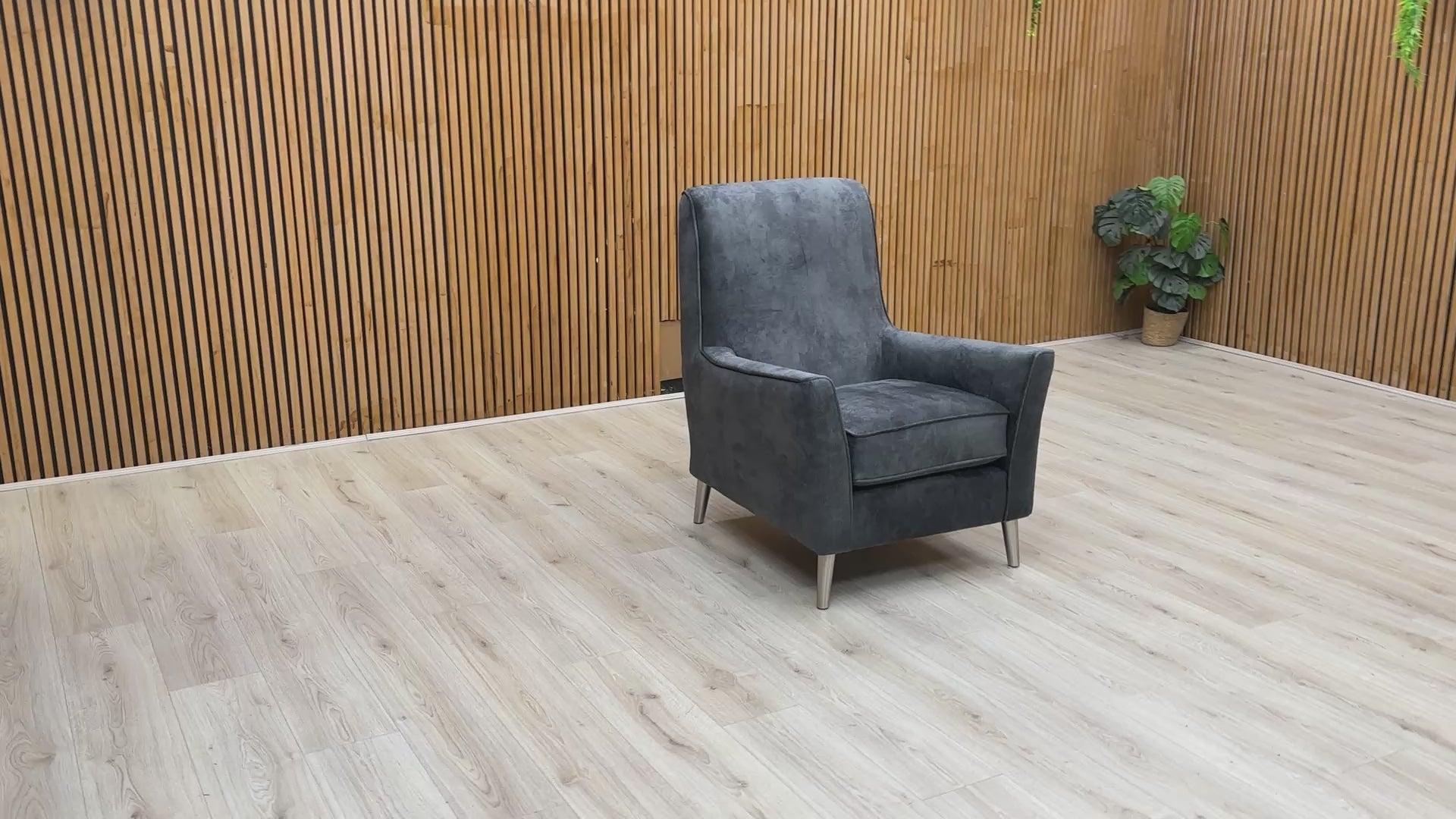 Video demonstration of the ‘Collins’ accent chair, showcasing the depth of the granite grey velvet and overall seating comfort.