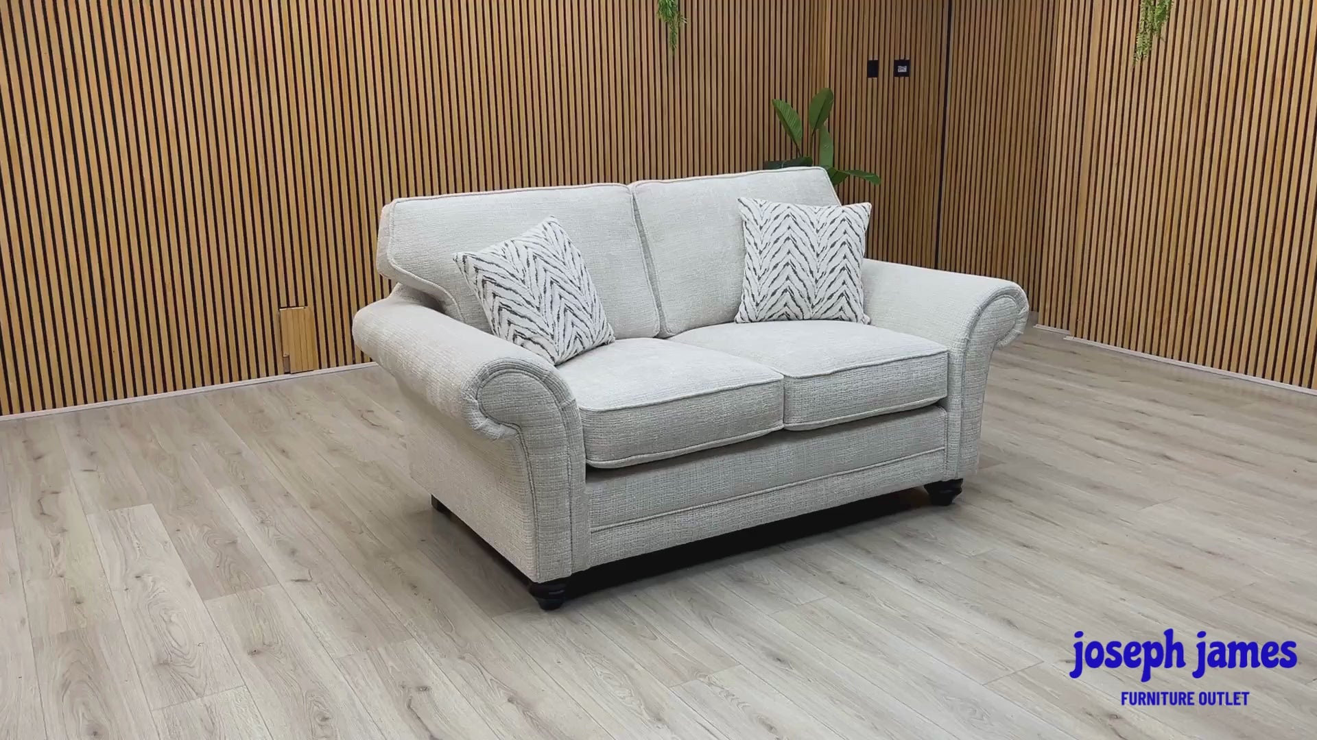 Video Of ‘Clara’ contemporary 2-seater stationary sofa, beautifully upholstered in high-grade Beige woven fabric with a sleek modern design.