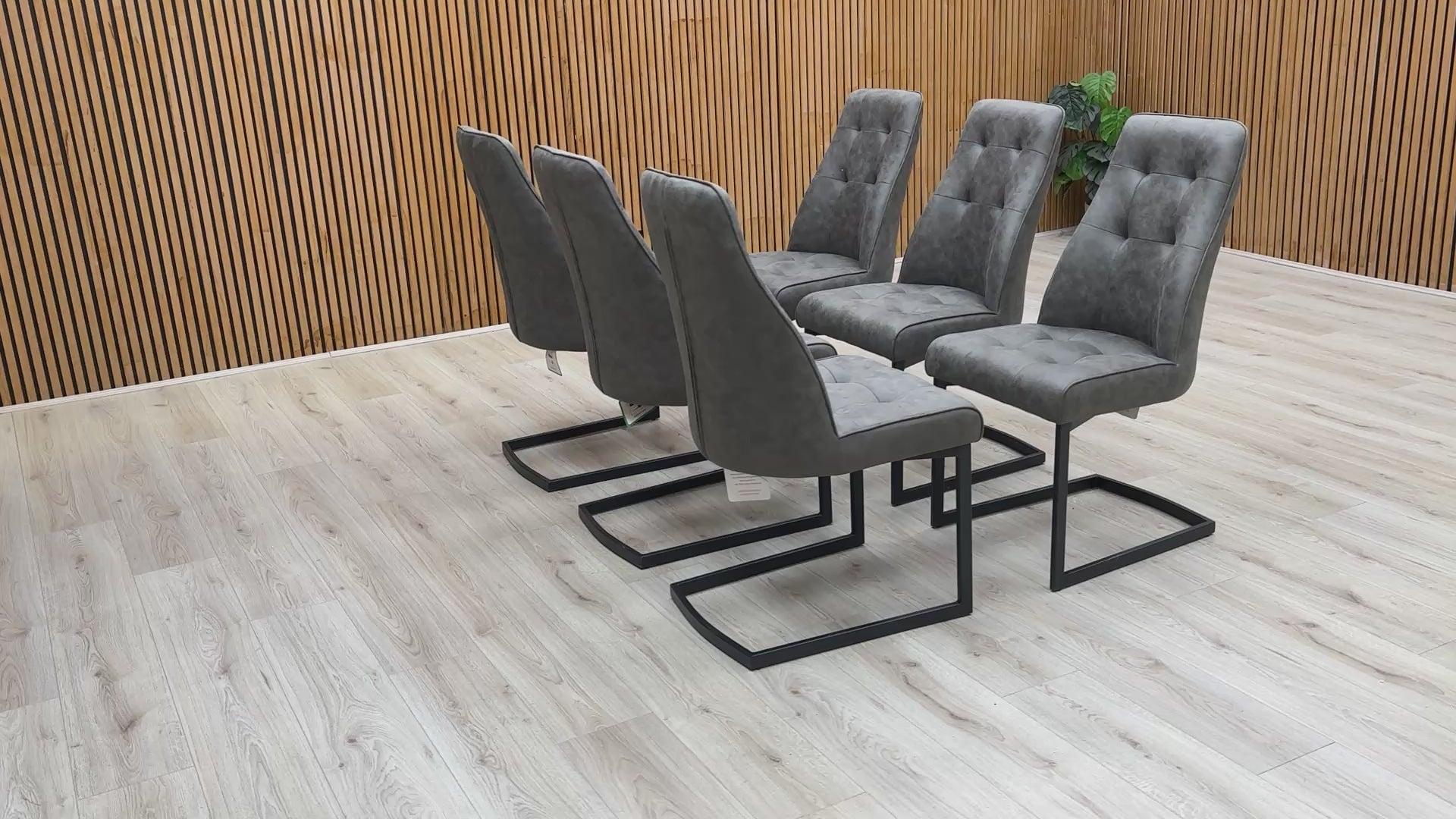 Video demonstration showing the build quality and cantilever flex of the Merlin suede dining chair.