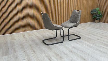 Video showing the 360-degree view and build quality of the Warrior taupe dining chair.