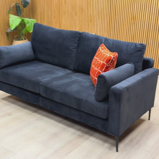 Product video tour of the ‘Wren’ Navy Blue Velvet 3 Seater Sofa, demonstrating the fabric sheen and build quality.