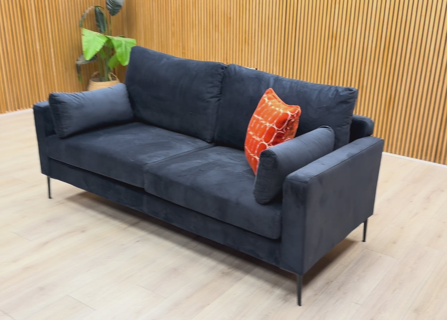 Product video tour of the ‘Wren’ Navy Blue Velvet 3 Seater Sofa, demonstrating the fabric sheen and build quality.