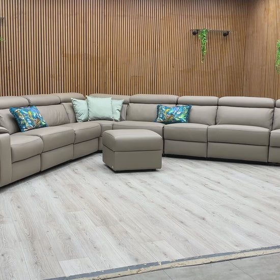 Product video play button for the Nicoletti Davide corner sofa, demonstrating the three independent power recline mechanisms and integrated storage features.