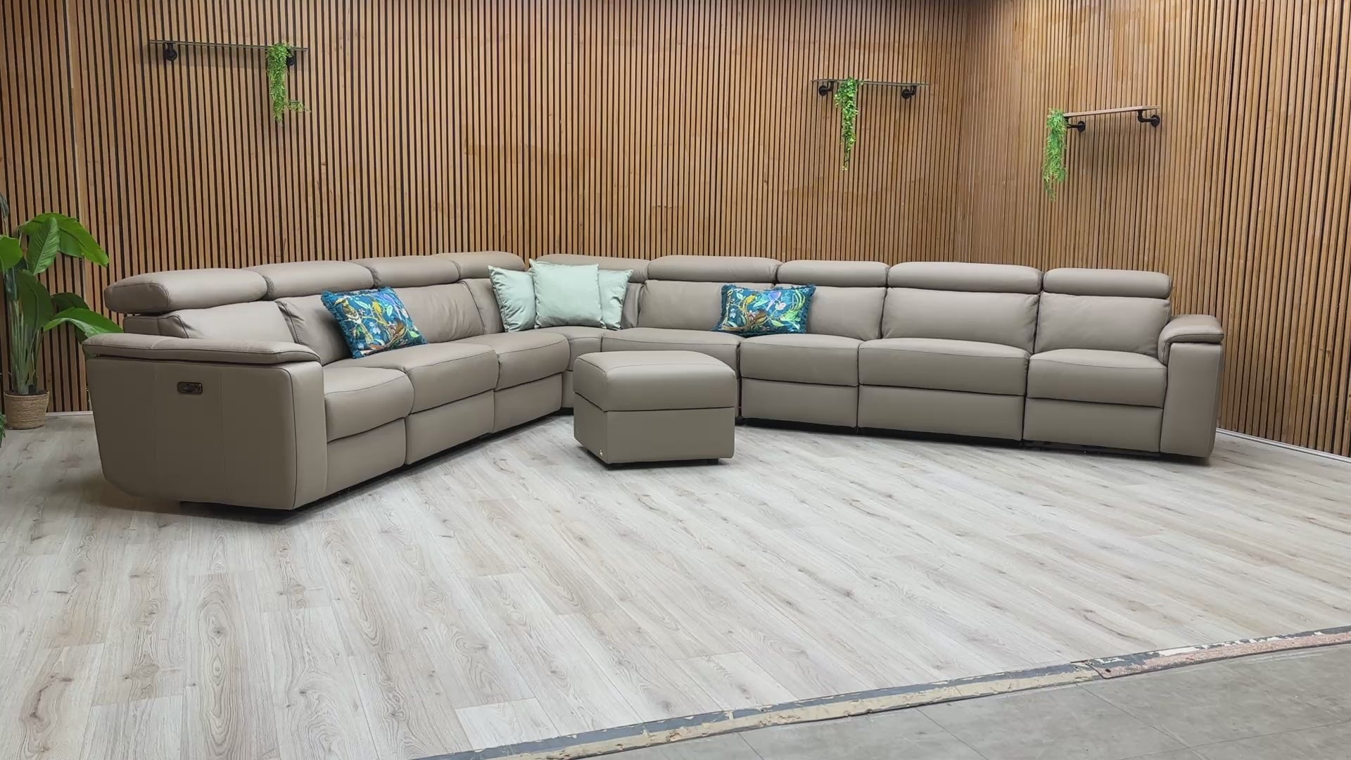 Product video play button for the Nicoletti Davide corner sofa, demonstrating the three independent power recline mechanisms and integrated storage features.