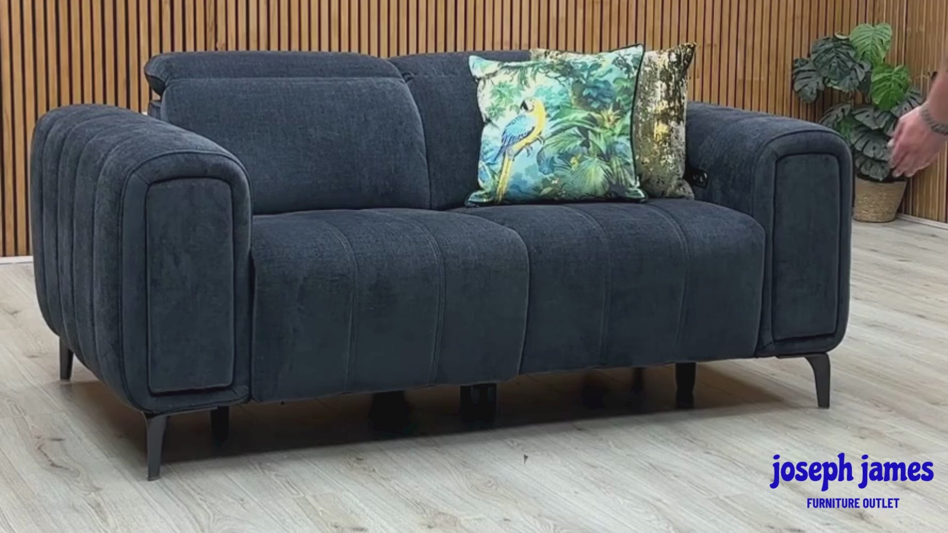 Video Of ‘Elphaba’ contemporary living room motion suite, featuring a 2-seater power recliner sofa beautifully upholstered in high-grade Manhattan Indigo 58009 fabric with integrated storage arms.