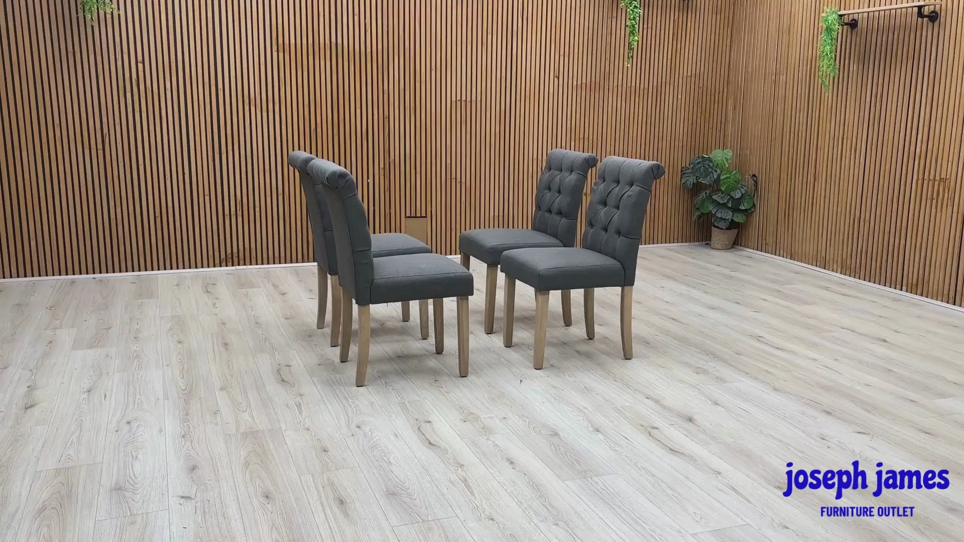 Video Of ‘Lewis’ contemporary dining chairs, showing a matching set of 4 individual chairs beautifully upholstered in a luxurious, durable Anthracite Grey fabric with an elegant button-back design.