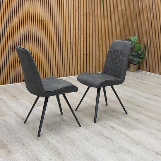 Product video tour of the ‘Warrior’ Charcoal Grey Fabric Cantilever Dining Chairs, demonstrating the structural flex and stability of the frame, fabric resilience, and overall build quality.