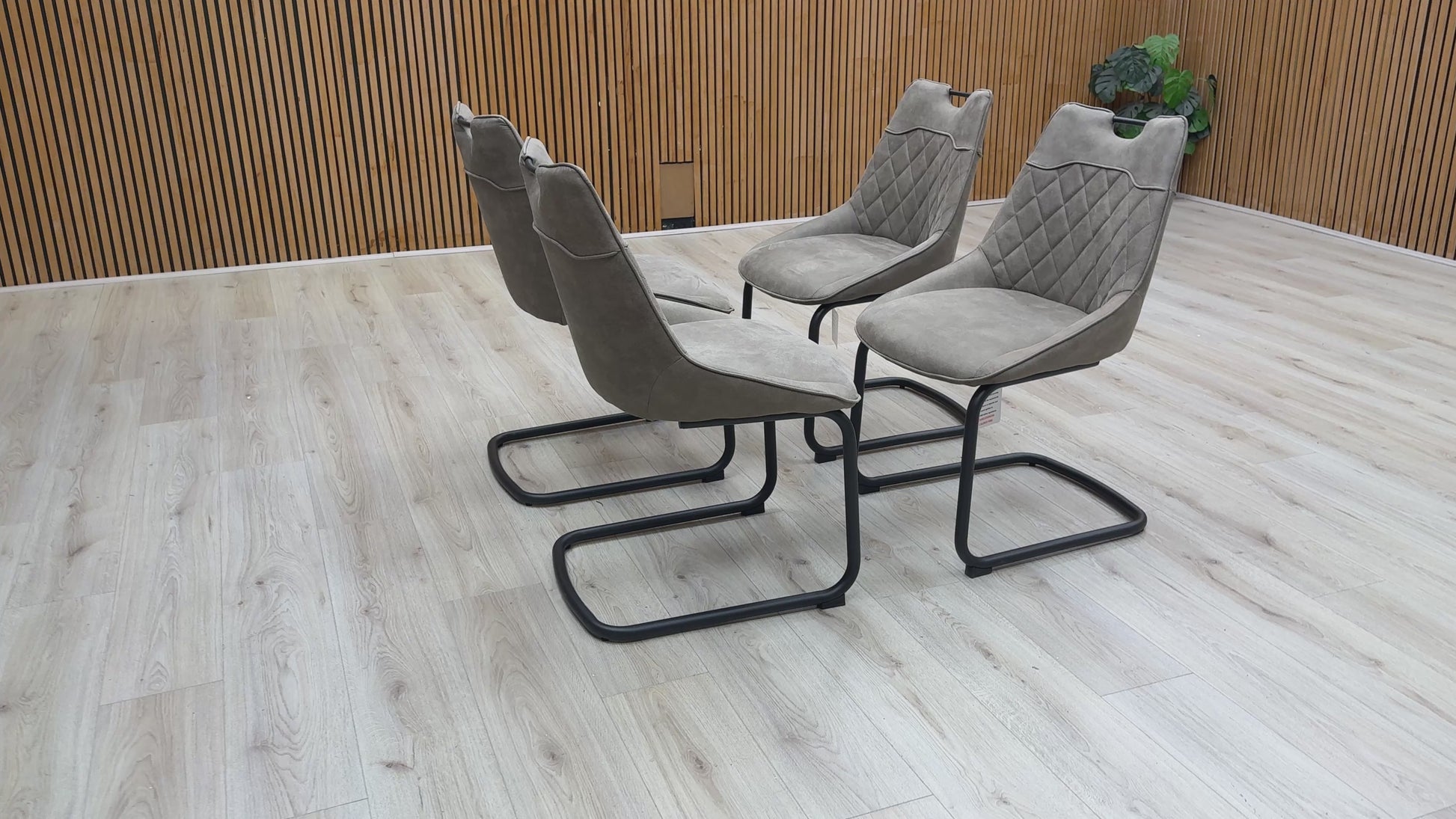 Video walk-around of the taupe Warrior chairs, demonstrating the fabric texture and the flex of the cantilever frame.