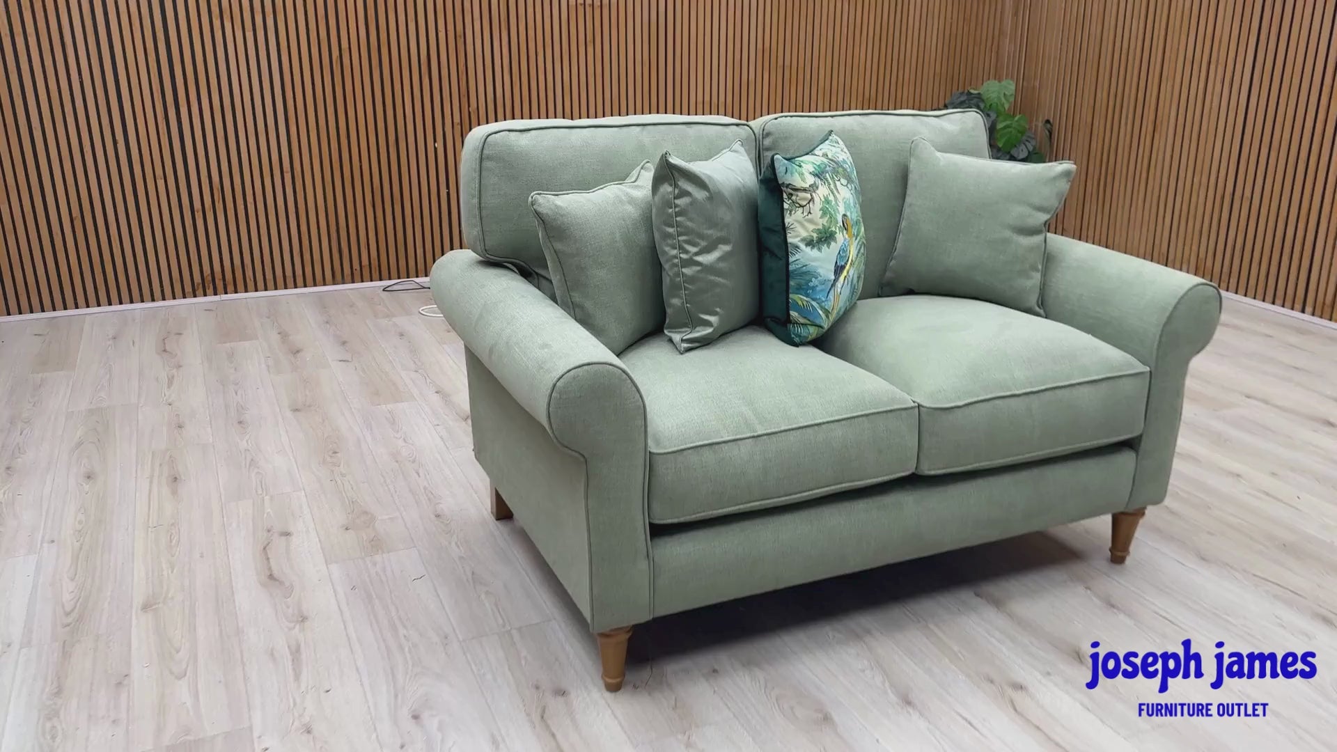 Video Of ‘William’ 2-seater sofa, beautifully tailored in rich, matte Cosmo Olive Green fabric upholstery.