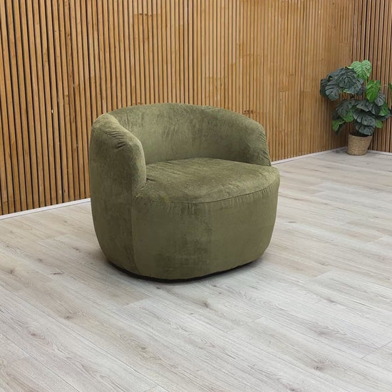 Video tour of the ‘Terry’ swivel chair, showcasing the 360-degree rotation and sage green fabric texture.