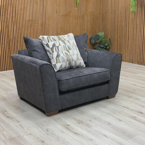 Product walkthrough video demonstrating the Como snuggler chair, showcasing the fabric's soft texture, cushion loft resilience, and its exceptional scale for reading nooks or cozy corners.