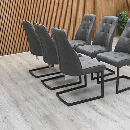 Video demonstrating the comfort and slight flex of the chair provided by the black metal cantilever base.