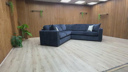 Video walk-around of the Chelsea denim blue chenille corner sofa, highlighting the fabric texture and cushion depth.