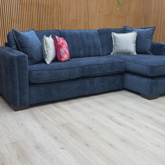 Video  for a clip demonstrating the size, comfort, and deep navy color of the 'Chelsea' corner chaise sofa.