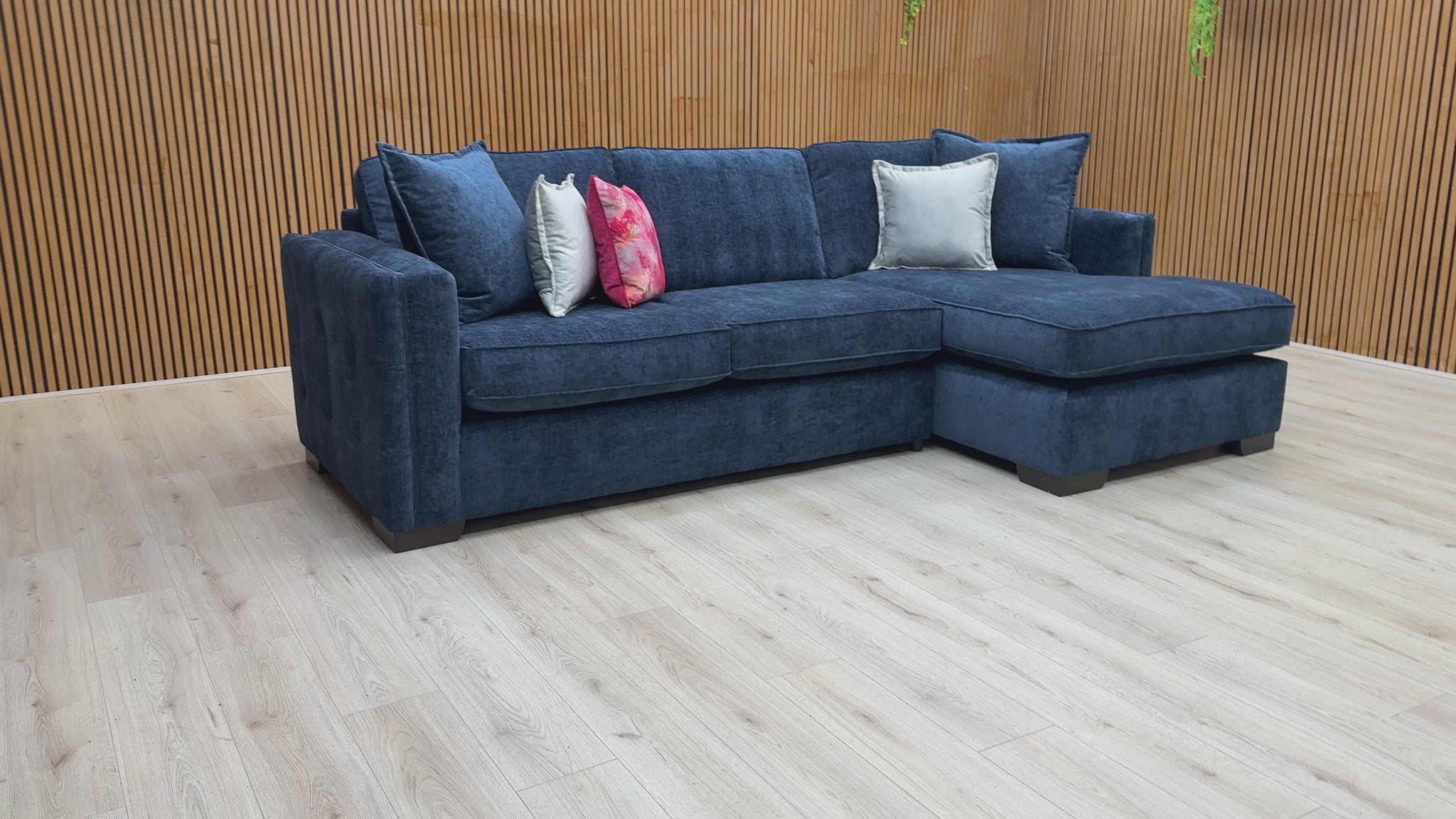 Video  for a clip demonstrating the size, comfort, and deep navy color of the 'Chelsea' corner chaise sofa.