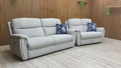 Product video tour of the ‘Ashton’ Bariba Grey 3+2 Power Recliner Set, demonstrating the smooth reclining motion, fabric texture, and overall comfort.