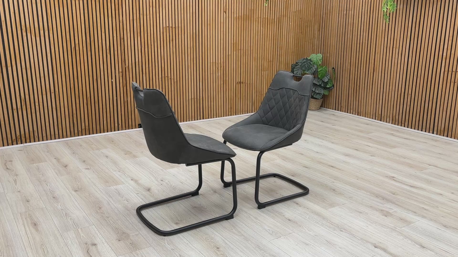 Product video tour of the ‘Warrior’ Charcoal Grey Fabric Cantilever Dining Chairs, demonstrating the structural flex and stability of the frame, fabric resilience, and overall build quality.